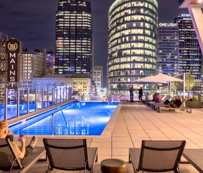 Three Light Luxury Residential Apartments Pool Exterior at Night in Kansas City.